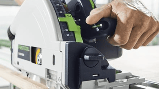 A hand-held circular saw in action.